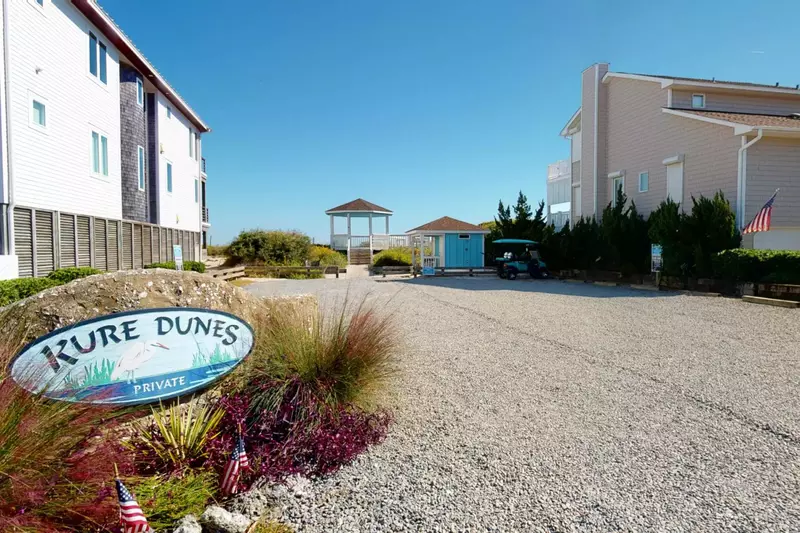 There is a shower for rinsing off and bathrooms at the private community beach access