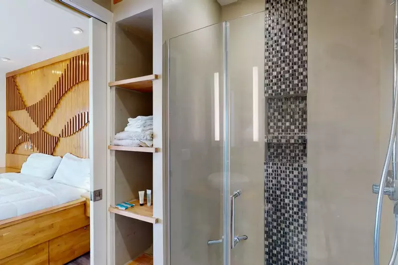 Exquisite European style tile work and built-ins in the walk-in master shower