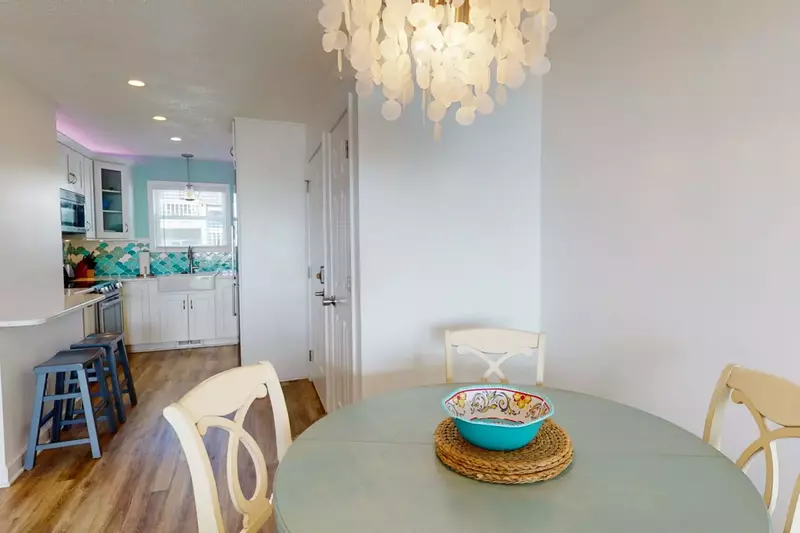 Fun light fixture over the table with seating for 4. Additional bar seating is also available.