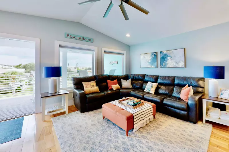 Top floor living area has a large comfy couch