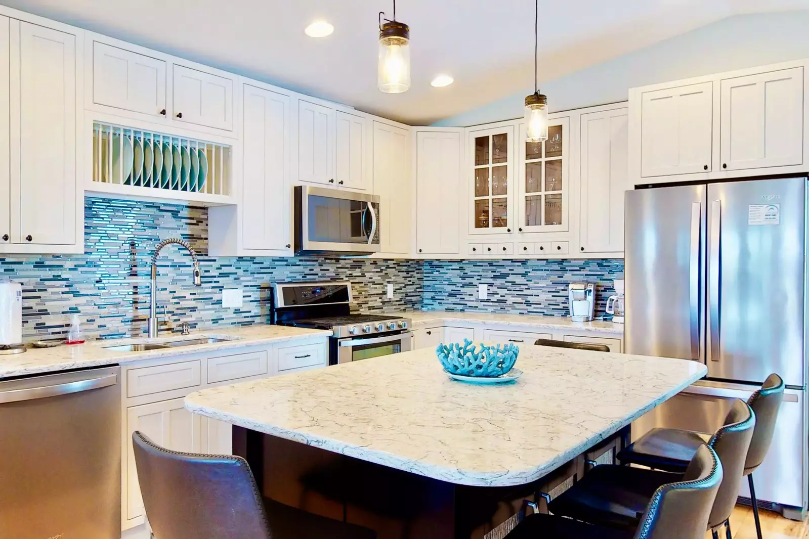 The beautiful kitchen is fully stocked with all the tools you need to make a great meal