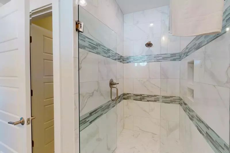 There is a huge walk in tile shower for the main owner suite