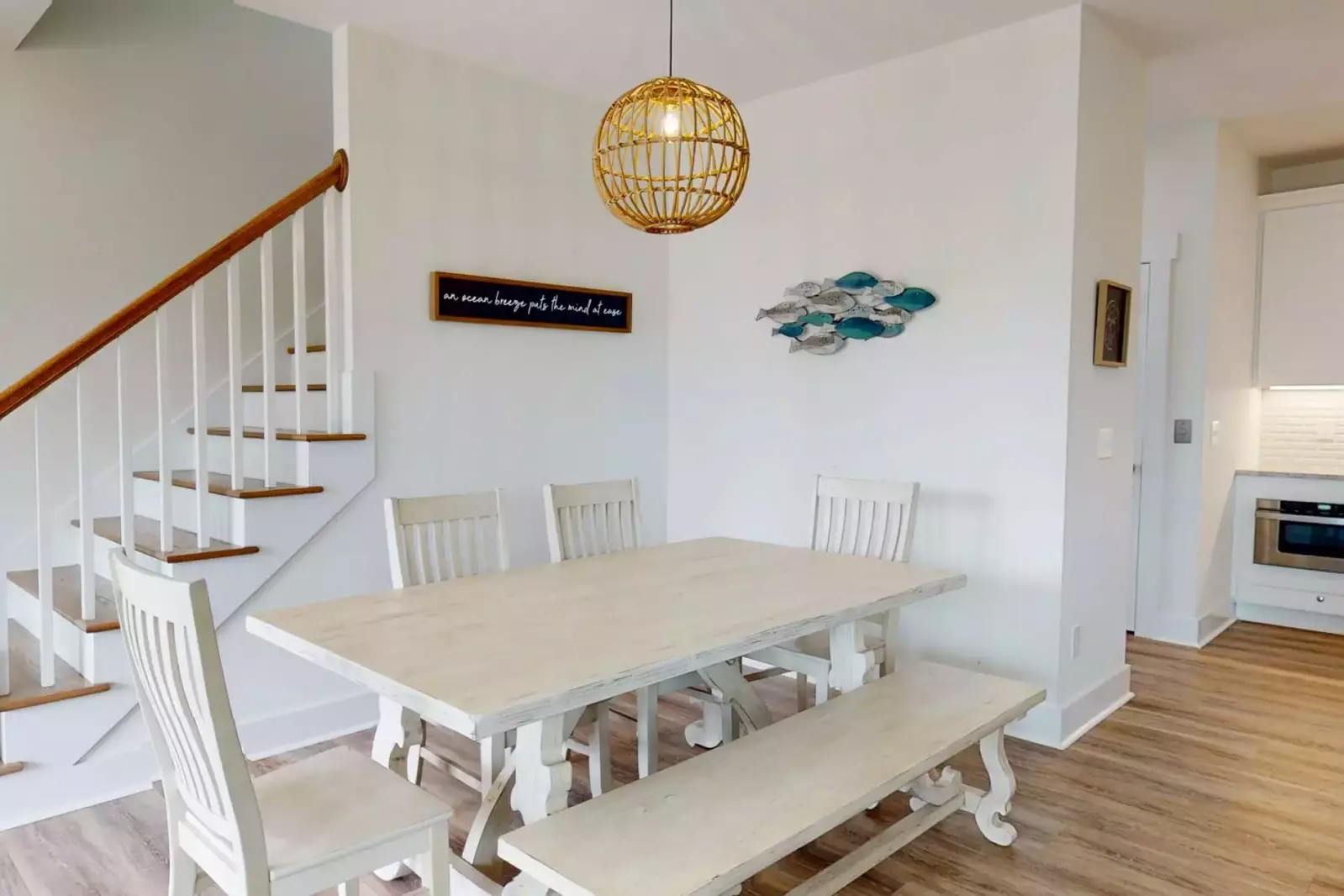 This dining table comfortably seats 7. Perfect to enjoy a family meal after a long day at the beach!