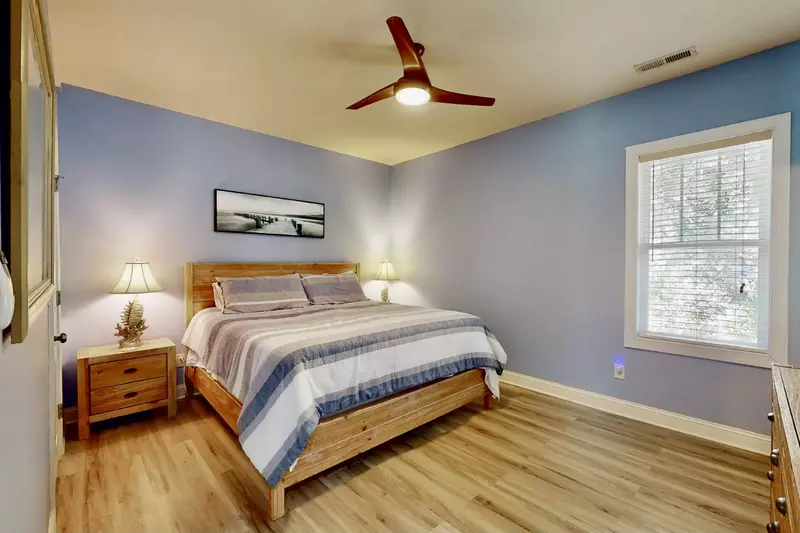 Top floor owner suite with king bed and attached full bath