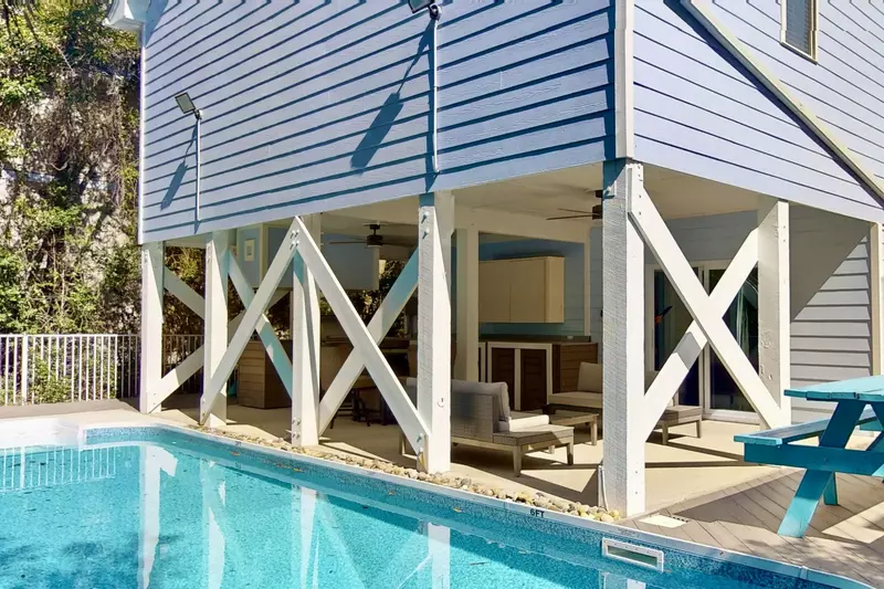 The covered outdoor kitchen is a grill master's delight