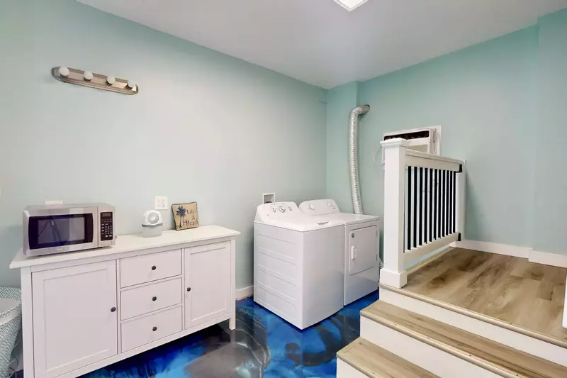 The first floor has a laundry area with an extra microwave