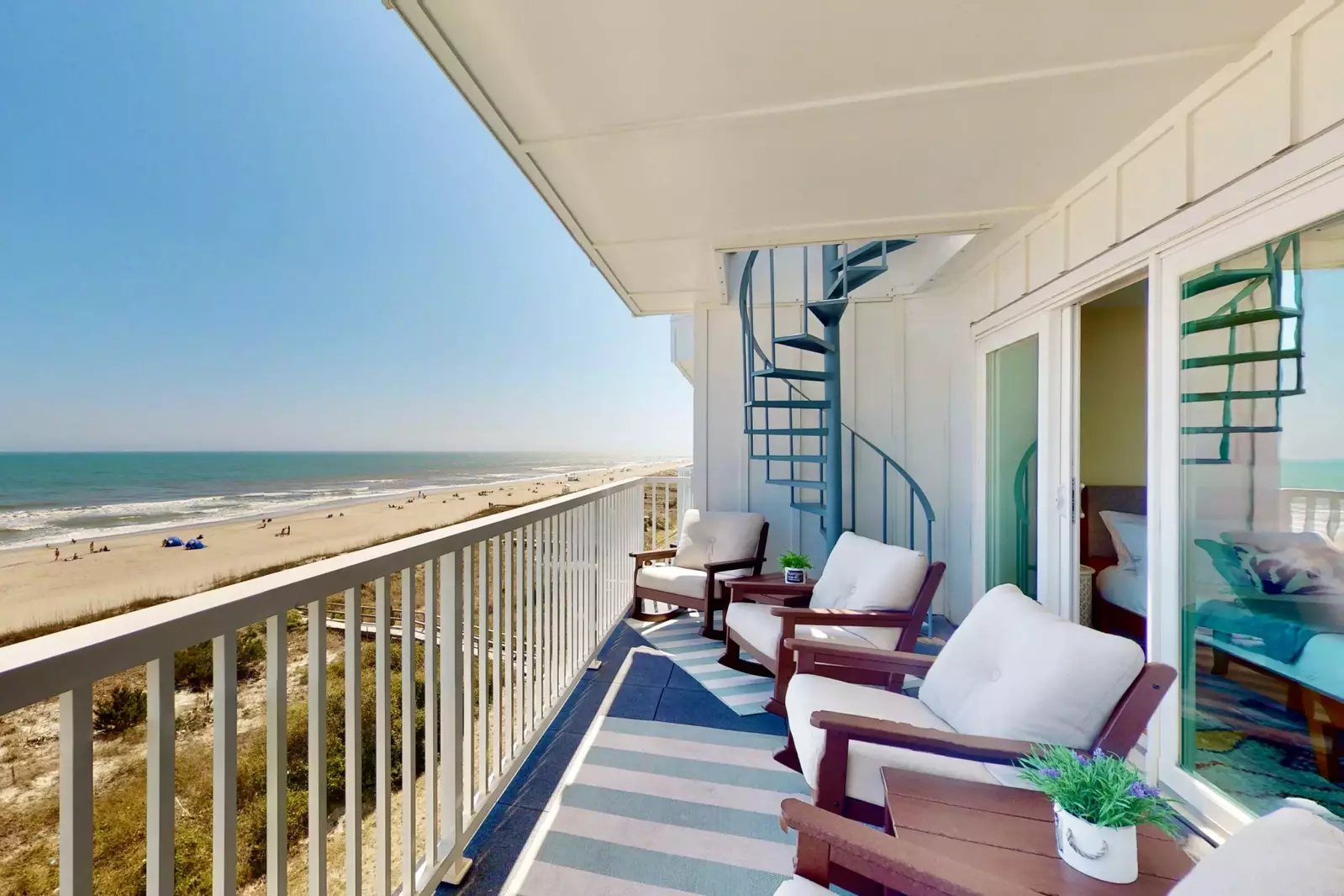 Relax on the comfortable outdoor furniture while watching the waves