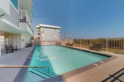 Listen to the waves crashing on the shore from the private community pool