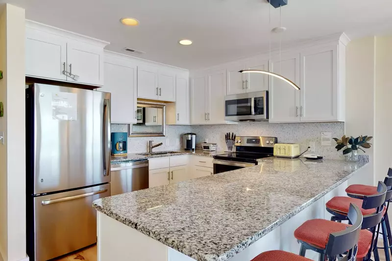 Spacious kitchen counter with bar top seating