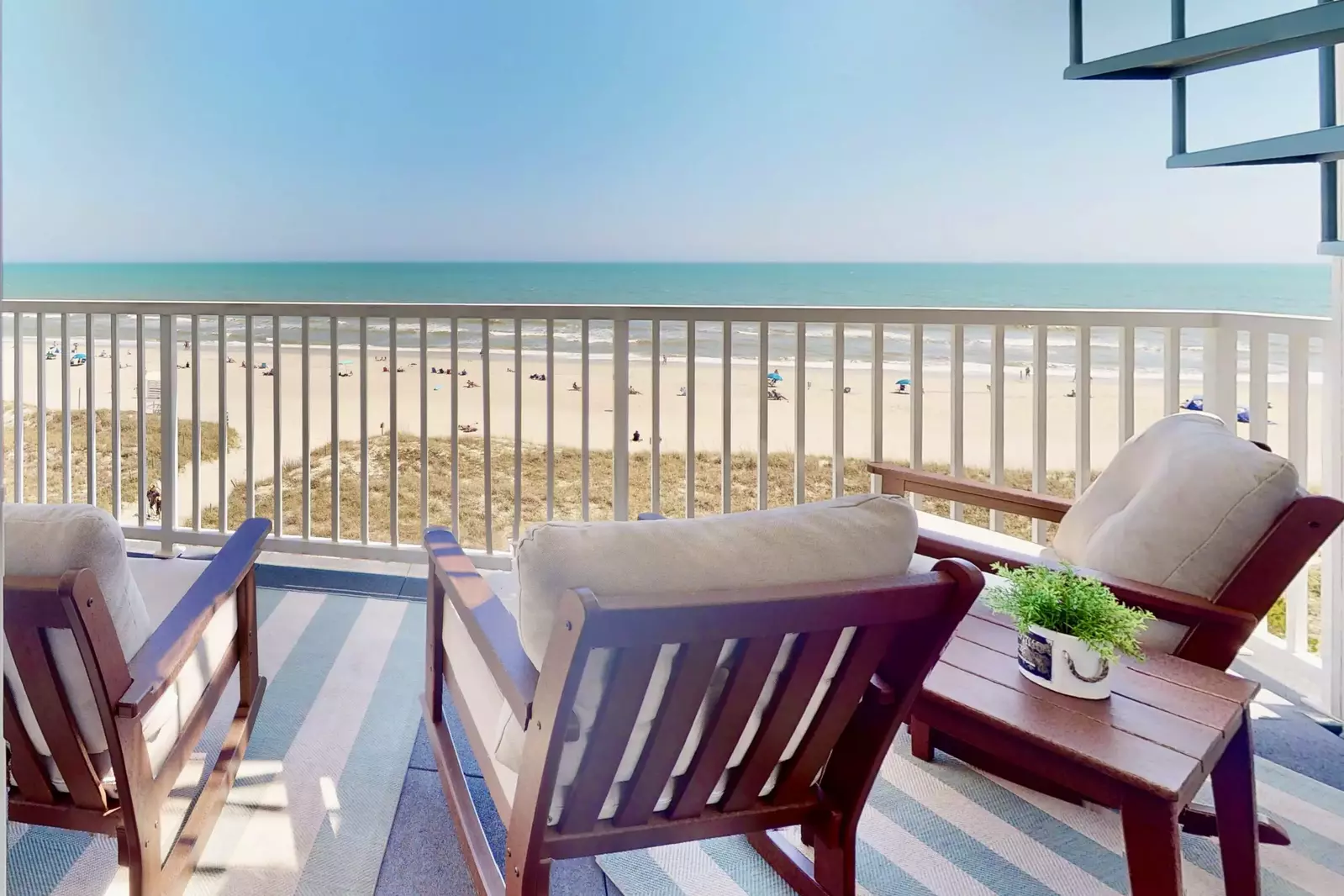 The owner's suite features sliding glass doors out to the oceanfront deck