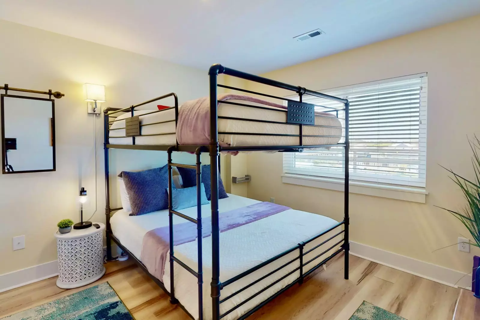 The bunk room features queen over queen bunk beds