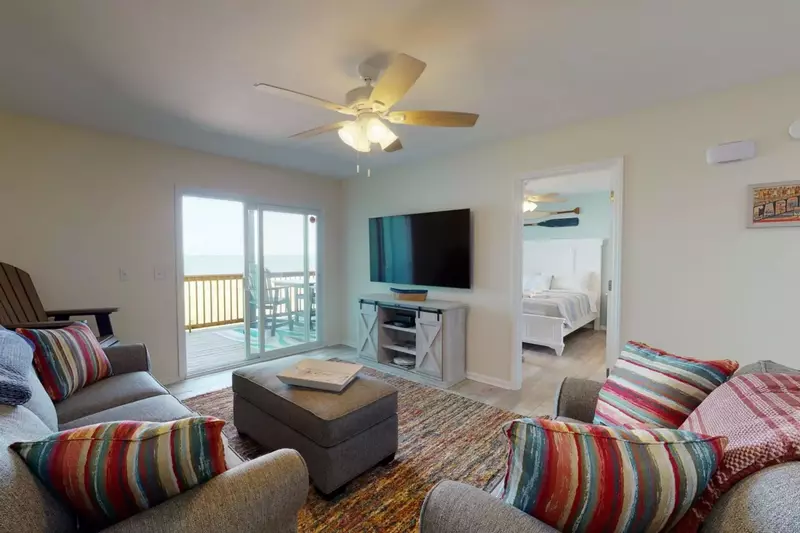 Plenty of seating in the living room with a view of the ocean
