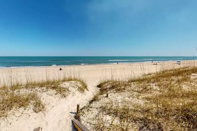 Enjoy the beach just steps from the back door