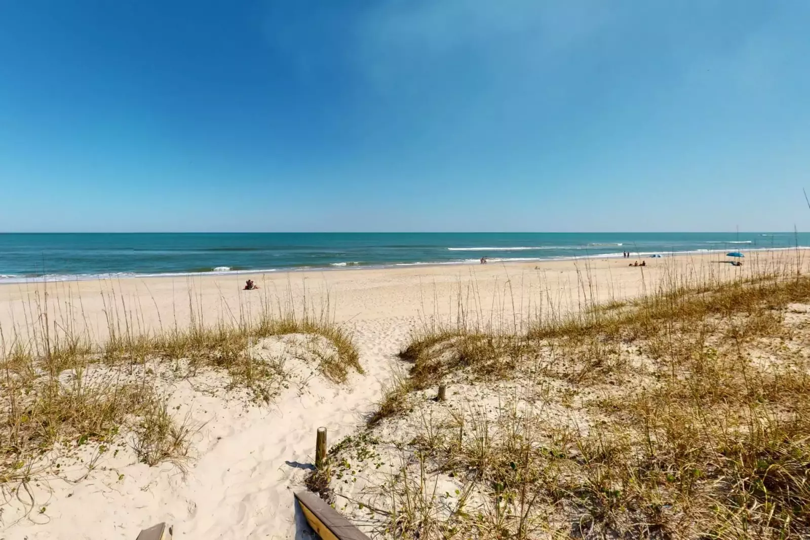 Enjoy the beach just steps from the back door