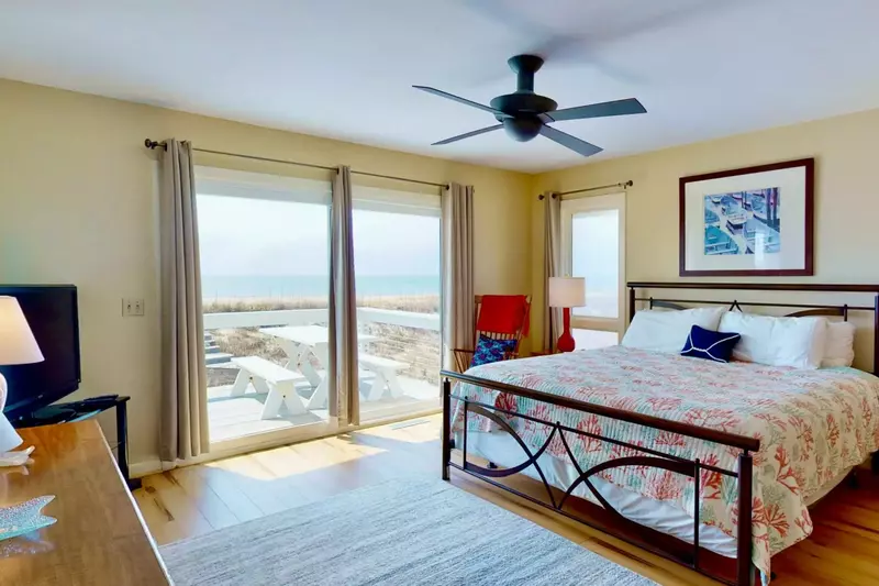 The 1st owner suite has ocean views, king bed, direct access to deck and private bathroom