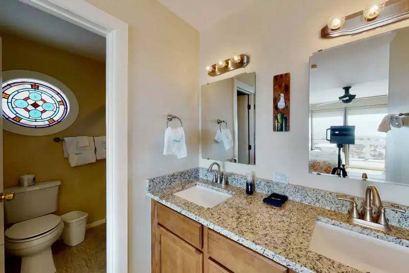 1st owner suite bathroom with stained glass window