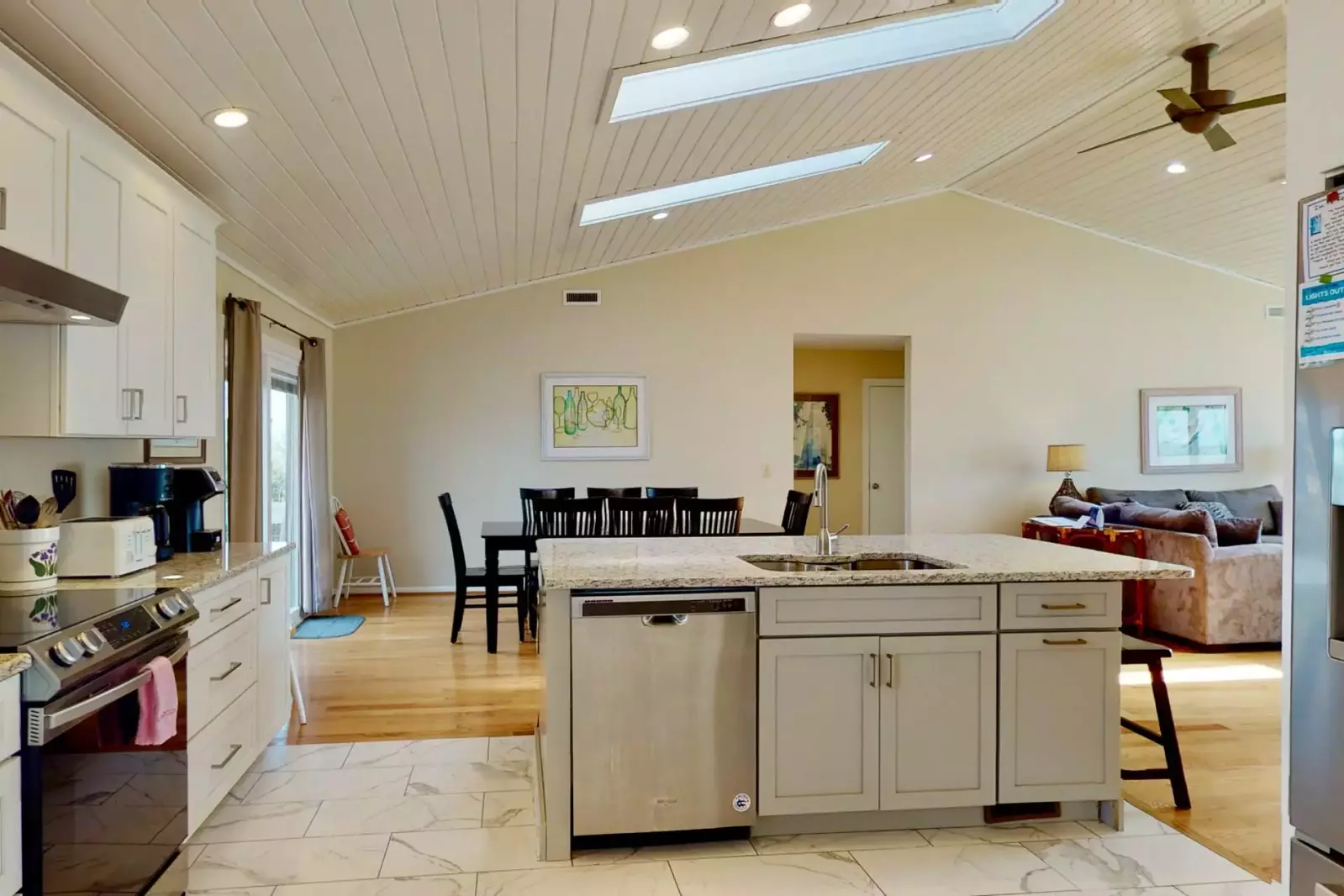 The kitchen has been redesigned and updated with granite counters, new appliances, flooring and cabinets