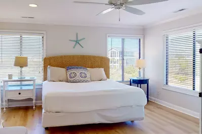 The primary bedroom has a king bed and a large private bathroom