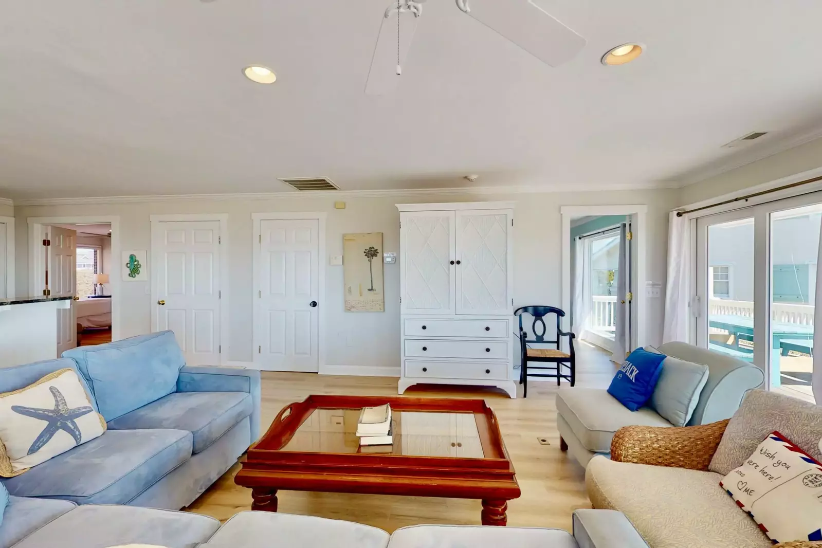 Comfortable and bright living room! Don't worry, there's a tv tucked in that cabinet.