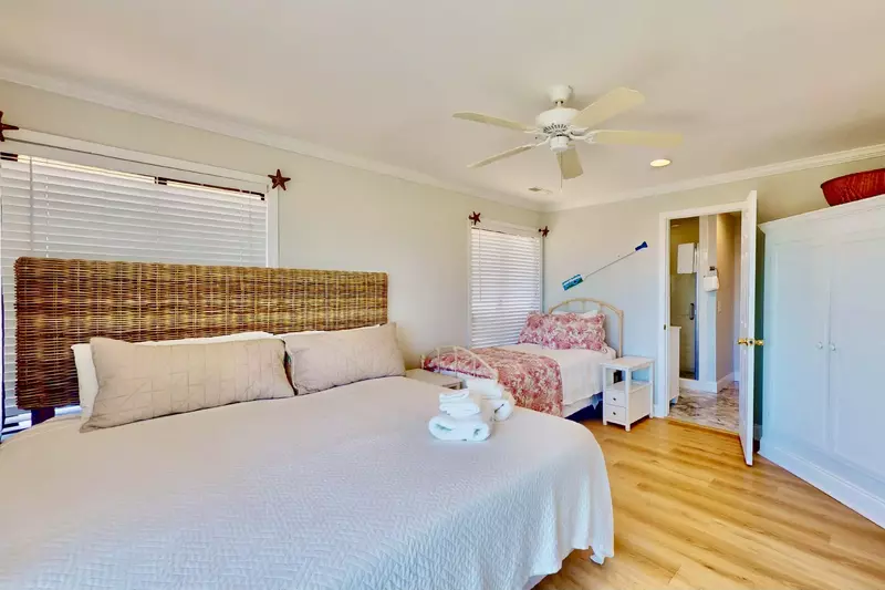 The third bedroom features a king size bed, as well as, a twin bed with a trundle and an en-suite full bathroom