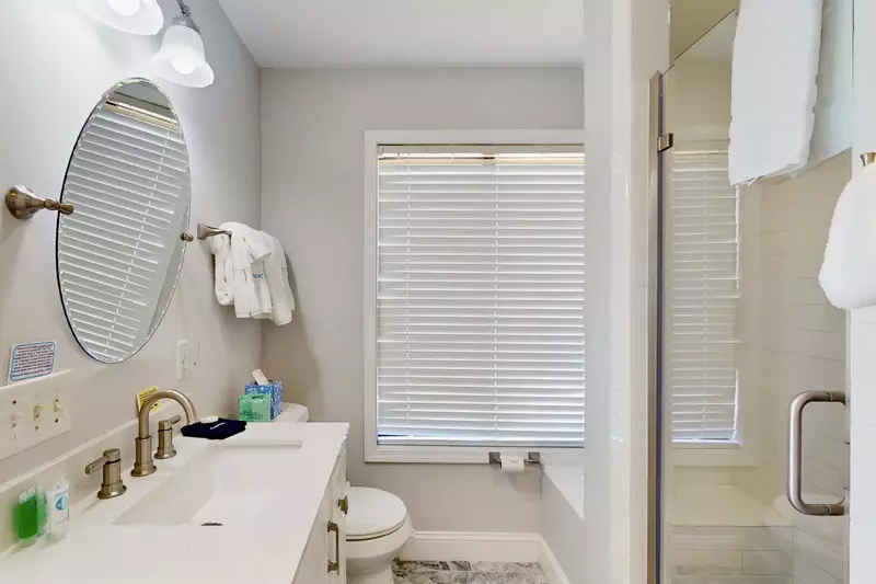 The third bedroom has a full bath attached with a walk in shower