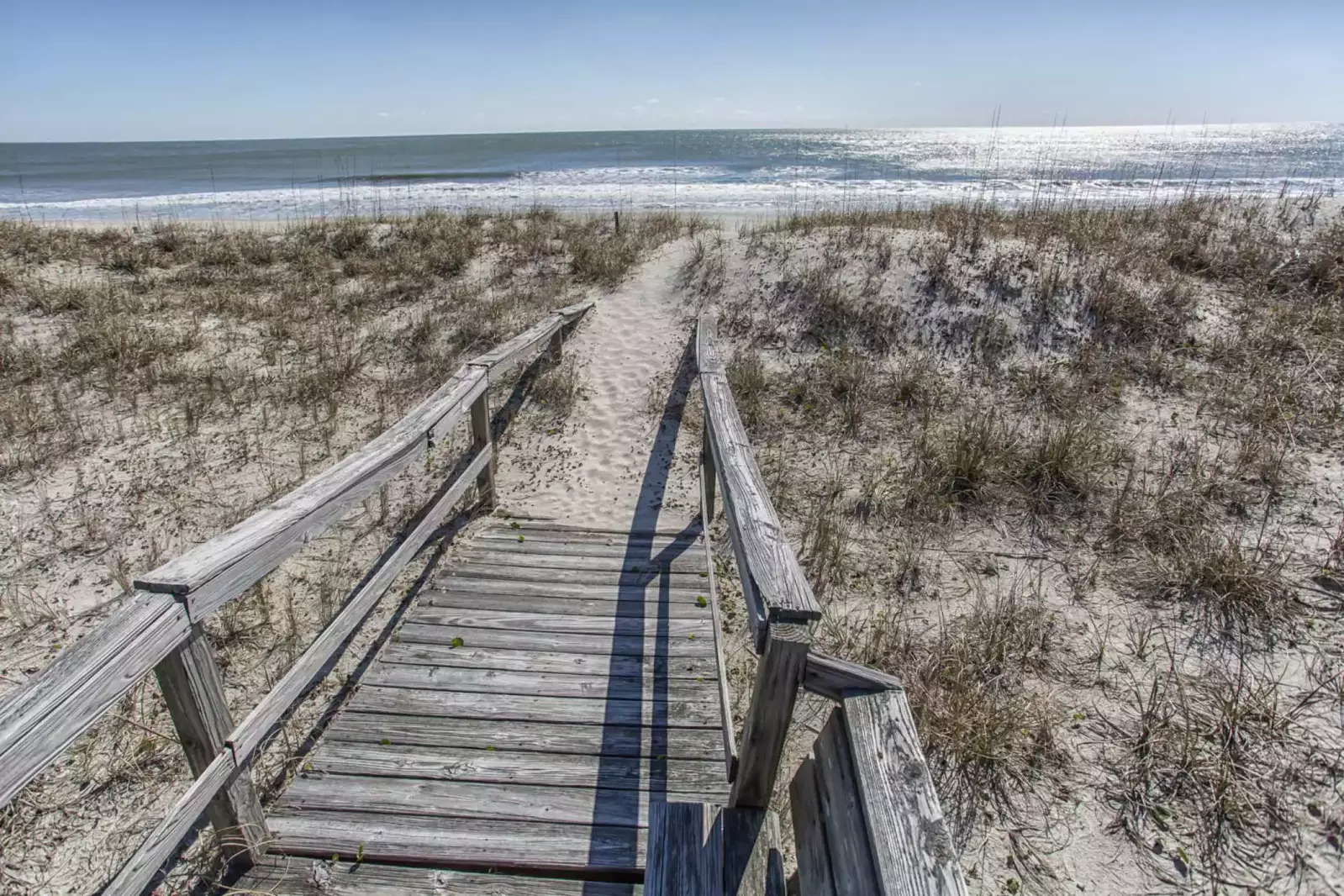 Just step over your own dune, knock off your shoes and you're there, the beach!!!