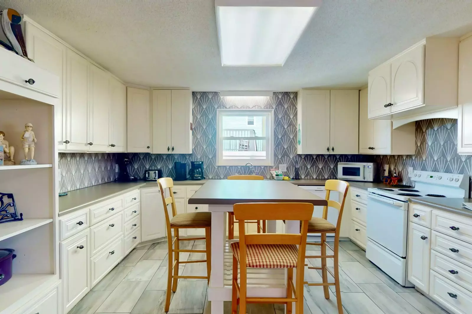 The kitchen offers plenty of counter space and island seating