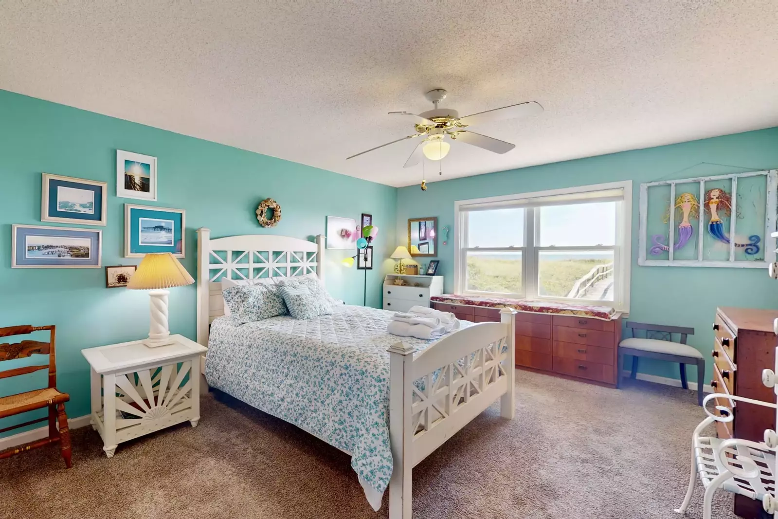 The owner's suite will make you feel all the beach cottage vibes