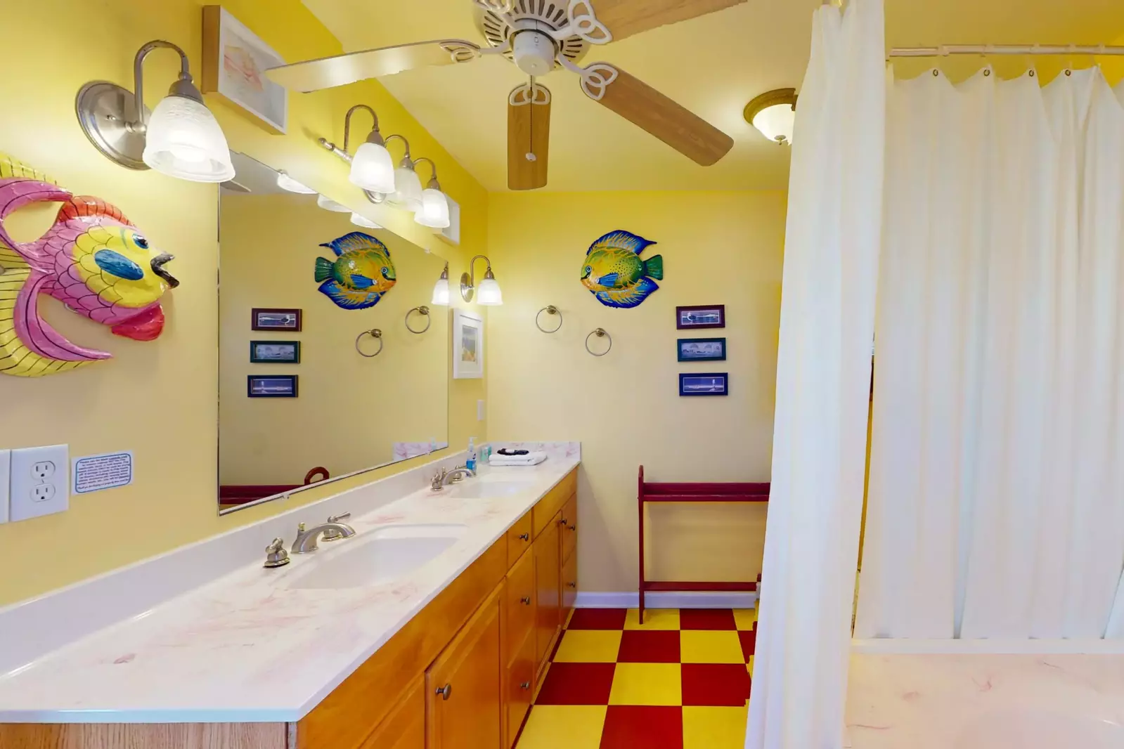 Plenty of counter space and a fan in this bathroom