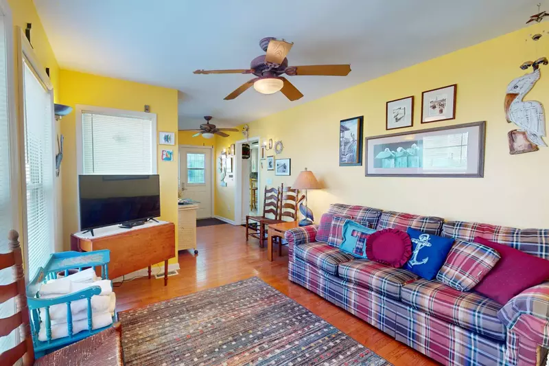 Front sunroom provides additional seating and a tv