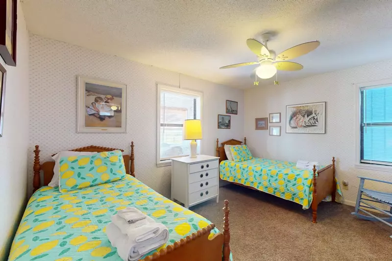 Bedroom 3 features two twin beds