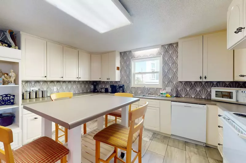 Cute kitchen with tons of counter space and storage