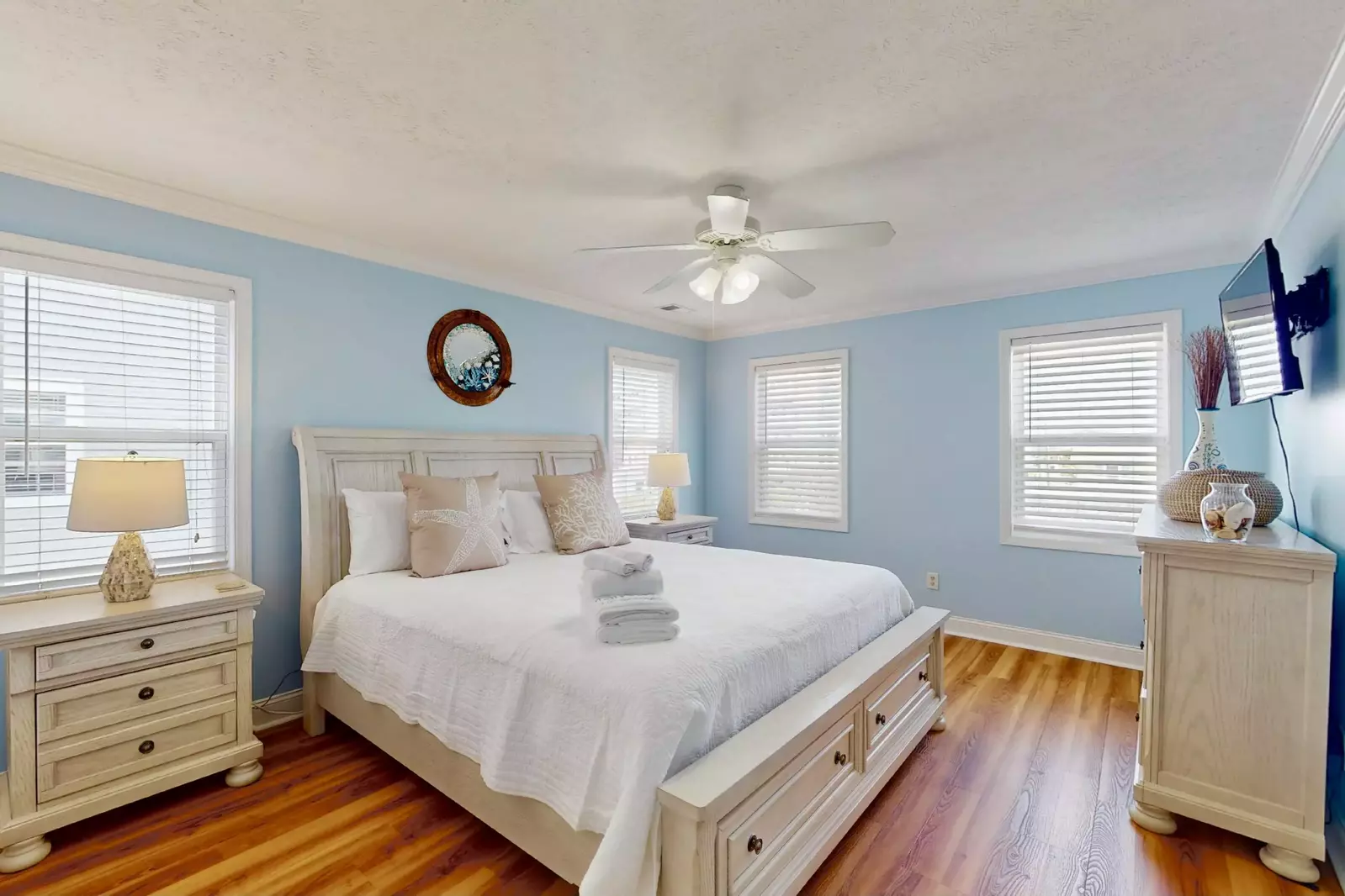 The owner's suite has 4 windows and a wall mounted tv