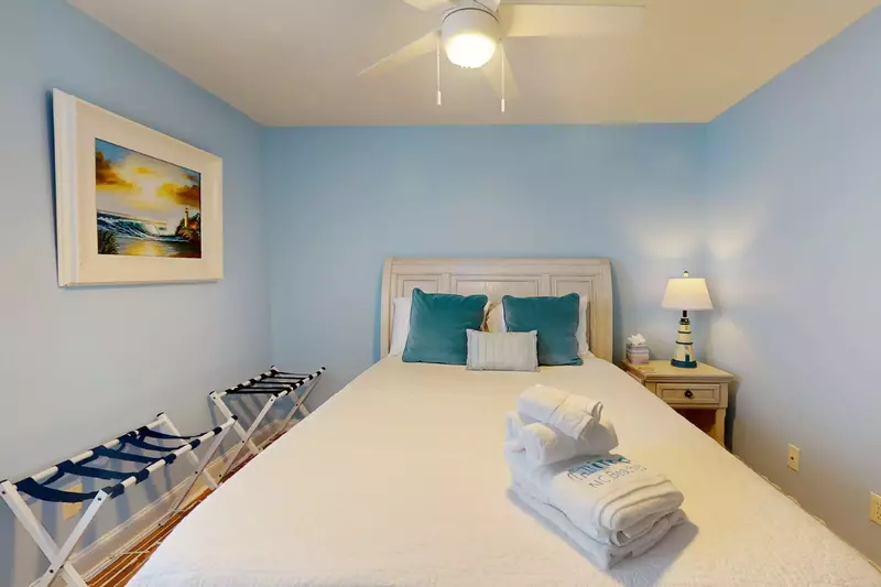 The beds are made and towels set out for you at Bleu Pearl!