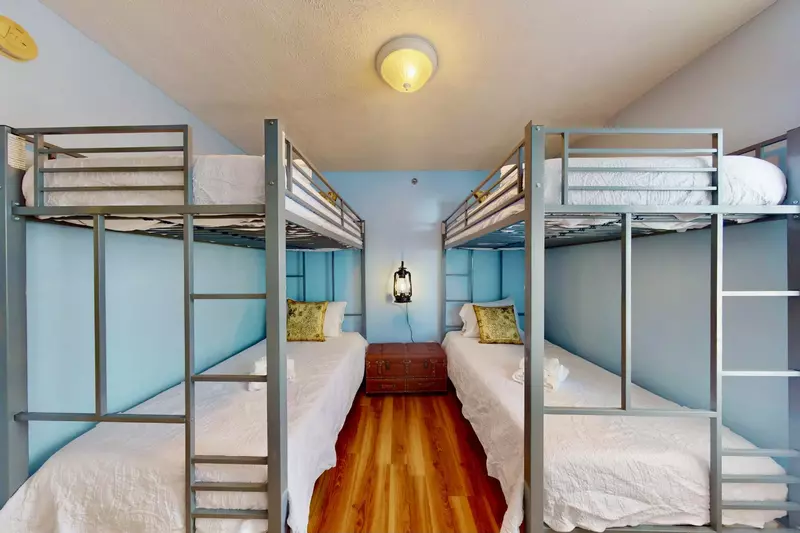 This cute bunk room sleeps 4