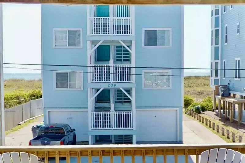 Listen to the waves crashing on the shore from the covered deck.