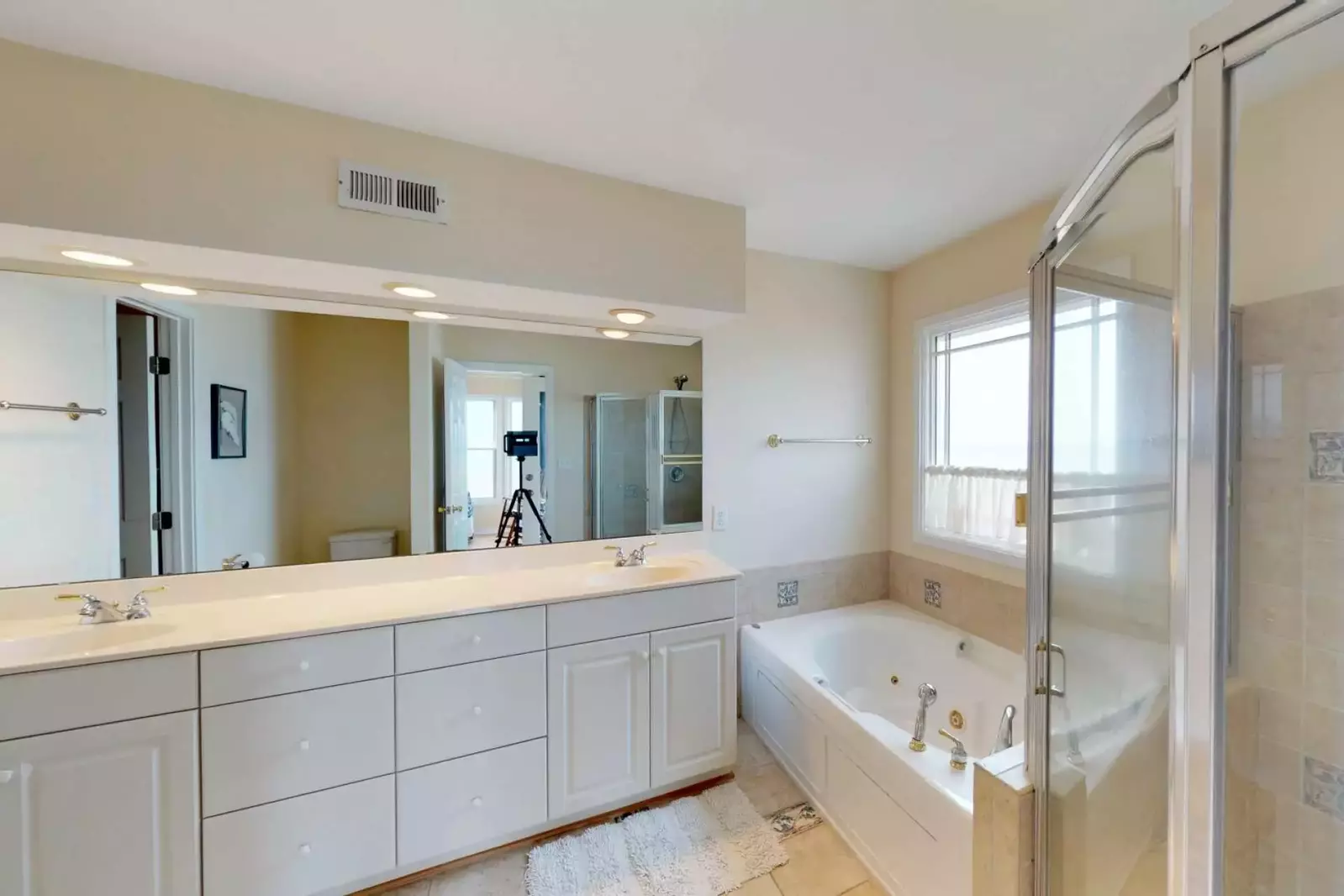 Double sink and soaking bath in the master bedroom.