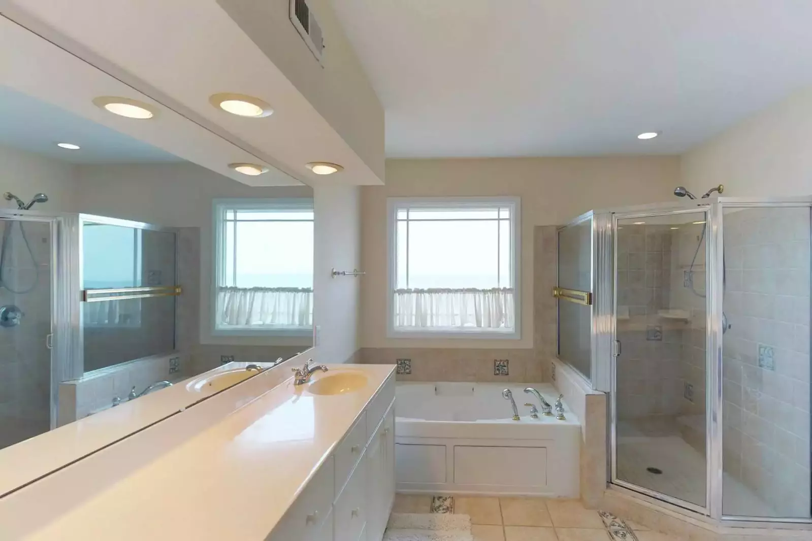 Large shower and tub in the owners suite bathroom