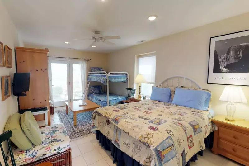 1st floor bedroom is perfect for the kids with bunk twins and a queen bed.