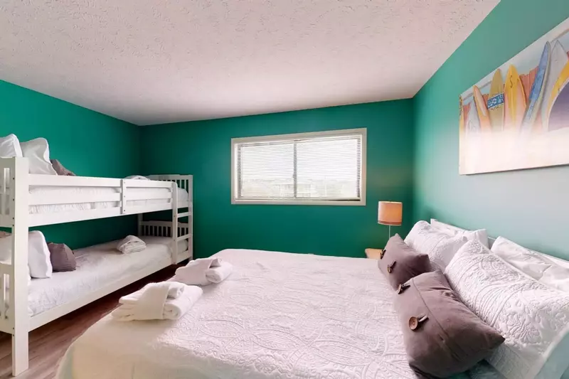 Top floor bedroom has a Queen and 2 twins with its own bathroom