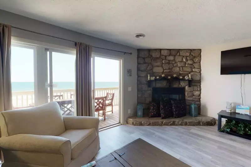 Watch the big game from the comfy couch, while listening to the calming waves.