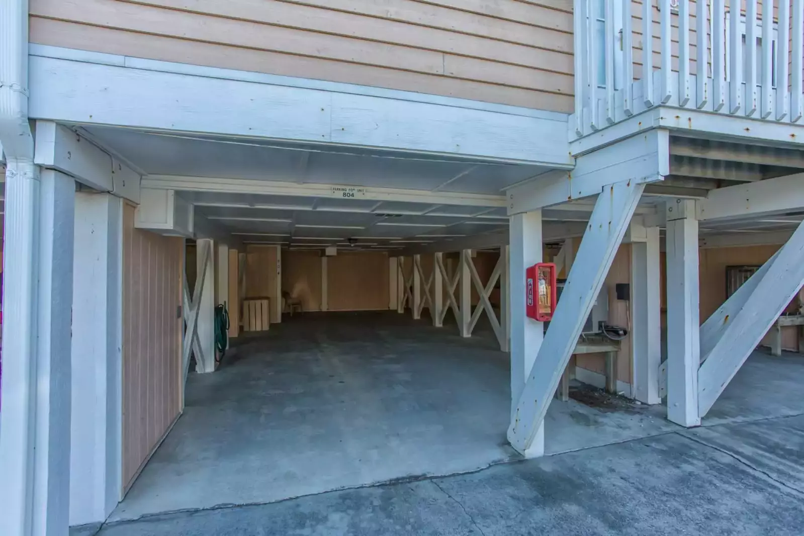 Enough parking for 2 full size vehicles in the carport area with access to a garden hose and an outdoor storage area