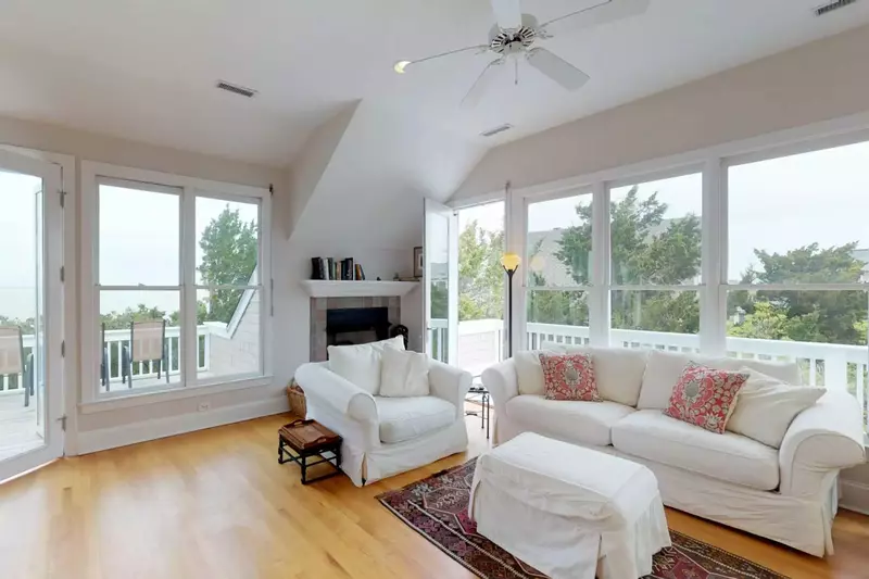 This living room opens to the wrap around deck with ocean views