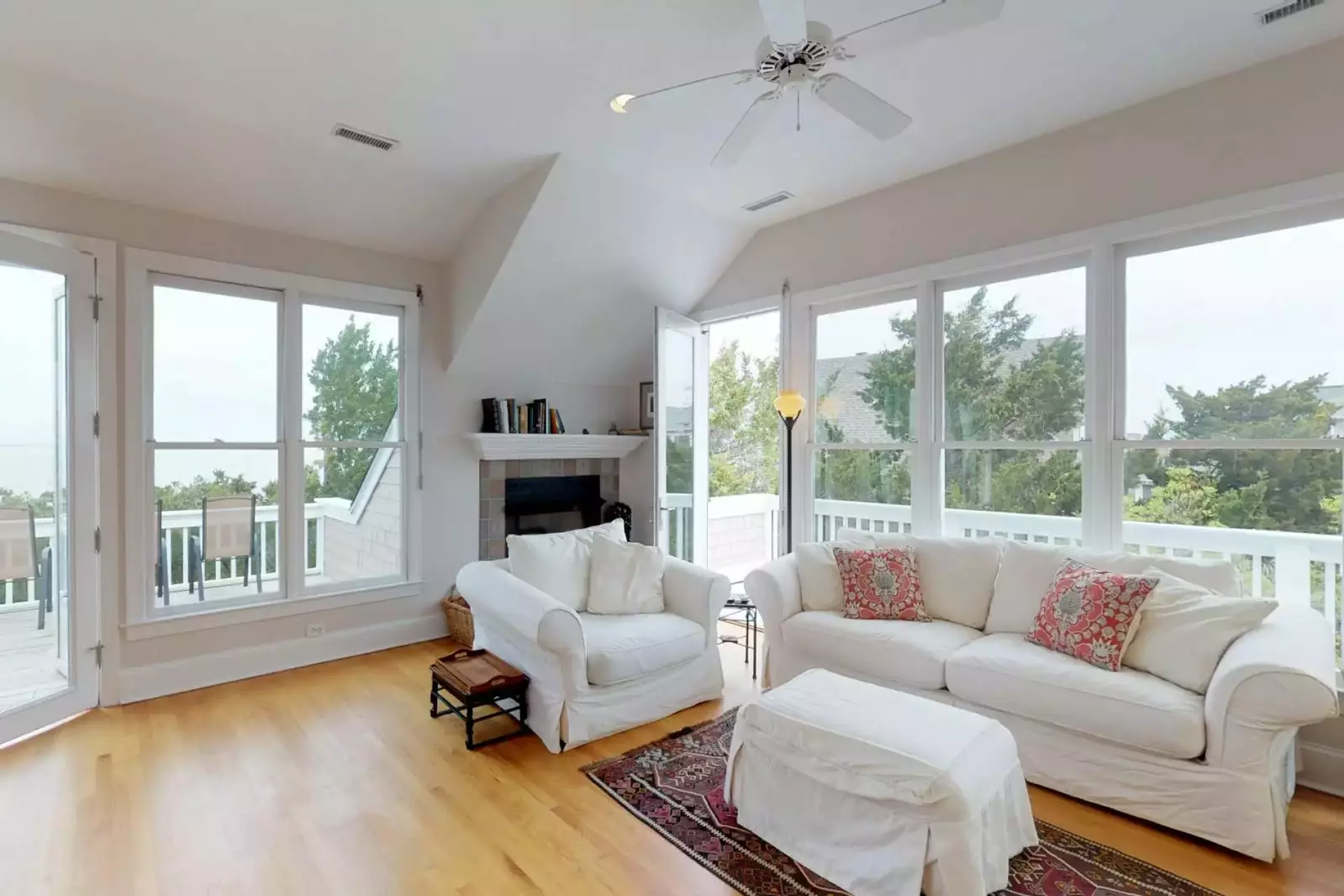 This living room opens to the wrap around deck with ocean views