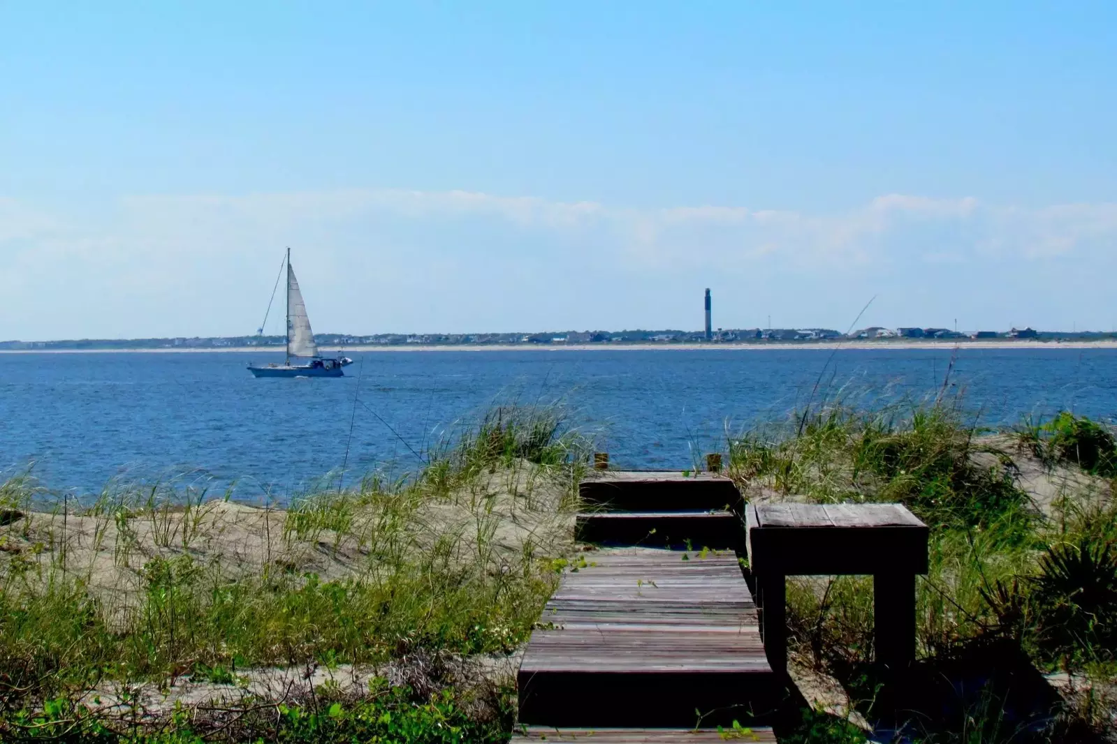 Sail boats, light houses, the beach, dolphins, birds, and 100 steps to the beach, not bad!
