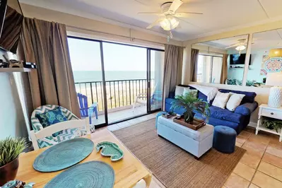 Main living area has a tv and beautiful view of the ocean