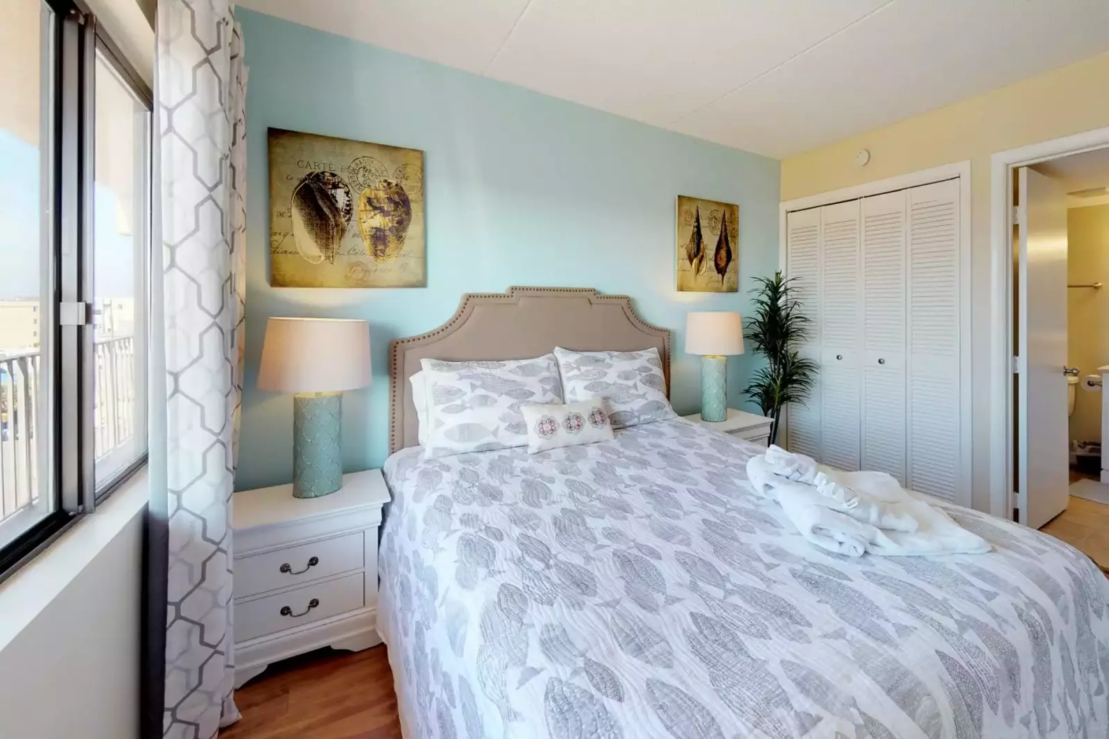 Enjoy this bright and beachy queen bedroom!