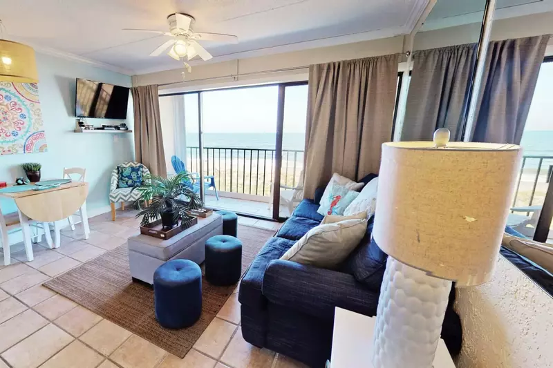 Relax in a beautiful living room area with a great view of the ocean.