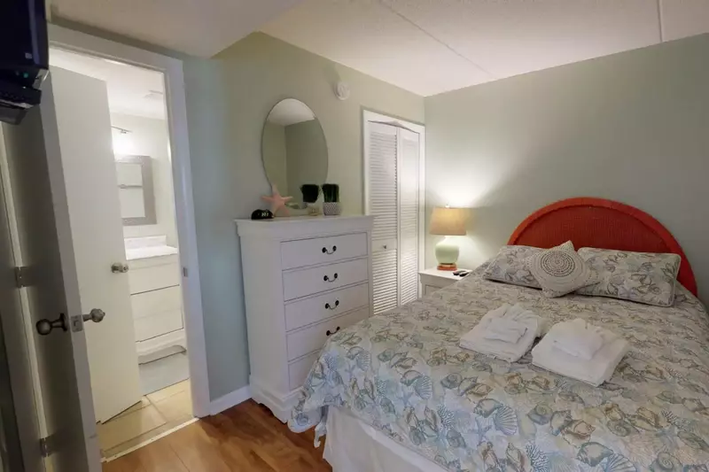 The second bedroom includes a Queen size bed and connected full bathroom