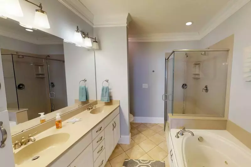 Owners suite bathroom has double vanity sinks, a walk in shower, and a large bathtub!